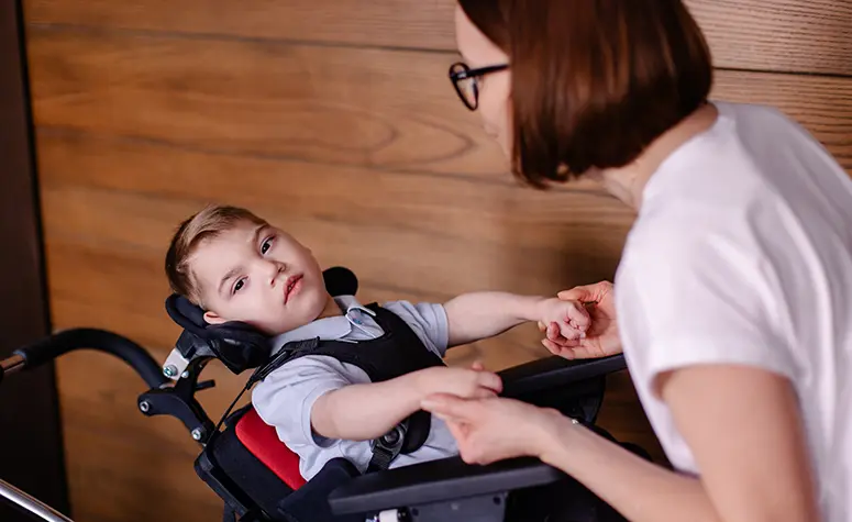 boy in reclining wheelchair